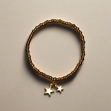 Elasticated Star Charm Bracelet In Gold Plate