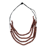 Necklace with multiple strands of brown beads on a white background