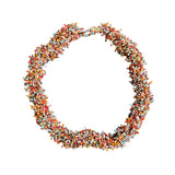 Suzie Blue Canada handcrafted beaded urchin necklace featuring colorful seed beads in a spiky sculptural design.