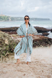 Suzie Blue Canada mint tie-dye rayon kimono with brown stripes, worn open over white pants on a beach.