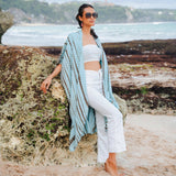 Suzie Blue Canada mint tie dye kimono made of 100% rayon worn by a model on a beach.