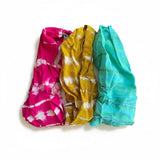 Suzie Blue Canada set of three tie dye bandanas in vibrant pink, mustard yellow, and turquoise blue.