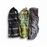Suzie Blue Canada set of three tie dye elastic headbands in black, olive green, and grey with horizontal patterns.
