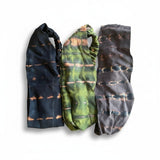 Suzie Blue Canada set of three tie dye elastic headbands in black, green, and grey with horizontal stripe patterns.