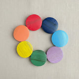 Suzie Blue Canada wooden rainbow bracelet with colorful wooden discs in red, blue, light blue, purple, green, yellow, and orange.